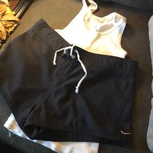 Nike swim trunks medium get free tank.